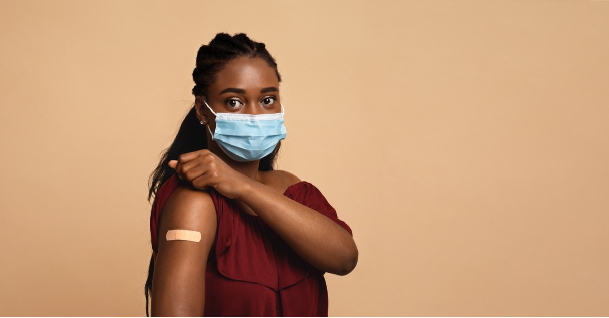 Black millennial lady in medical face mask-img