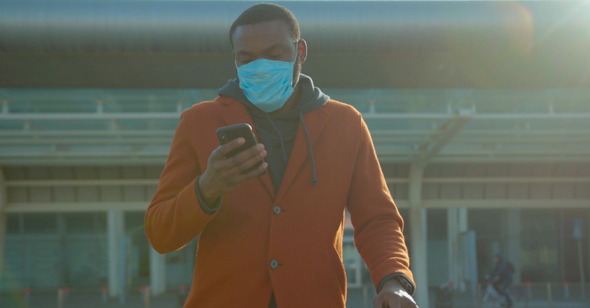 american man wearing Protective Face Mask use phone-img