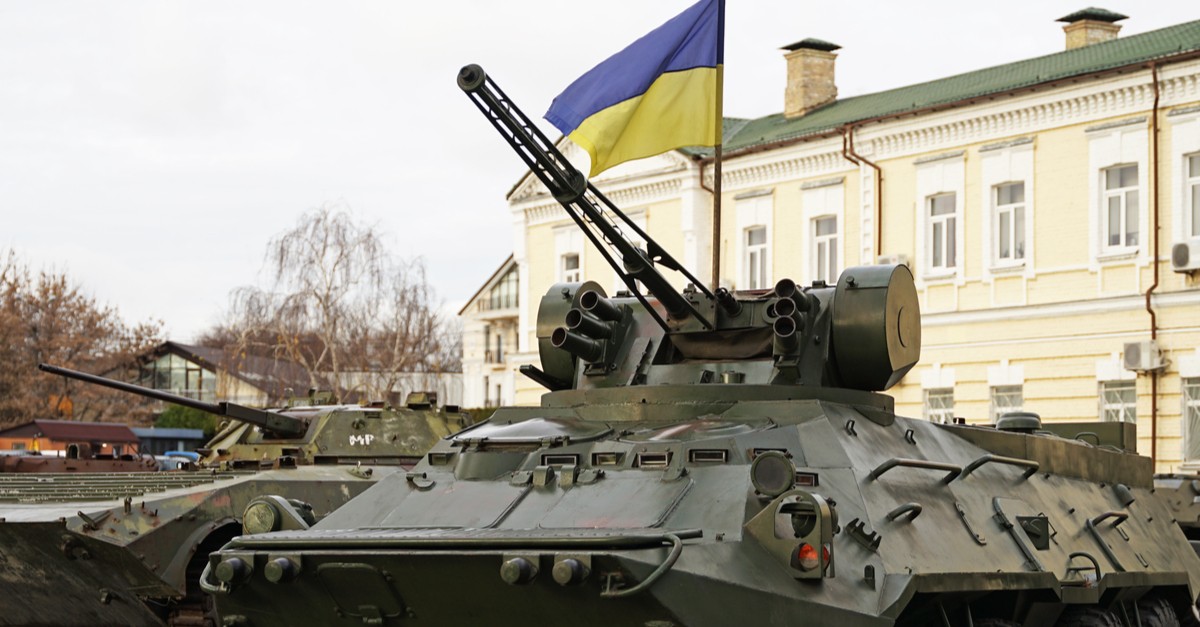 Army troops transporter and tank with Ukrainian flag, Ukraine – Russia war crisis concept-img