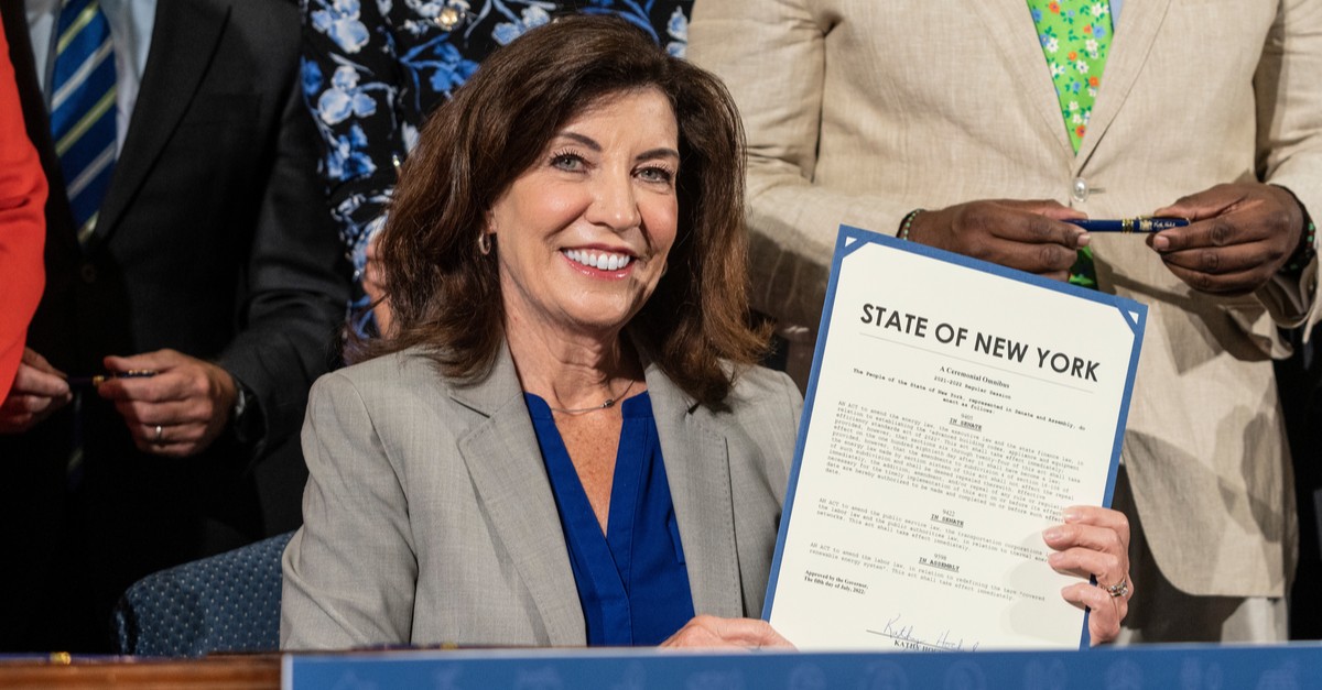 Governor Kathy Hochul poses with signed bills-img