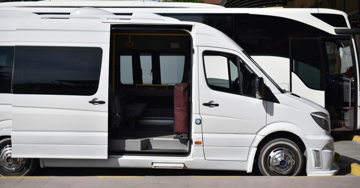 shuttle minibus with open door on bus station-img