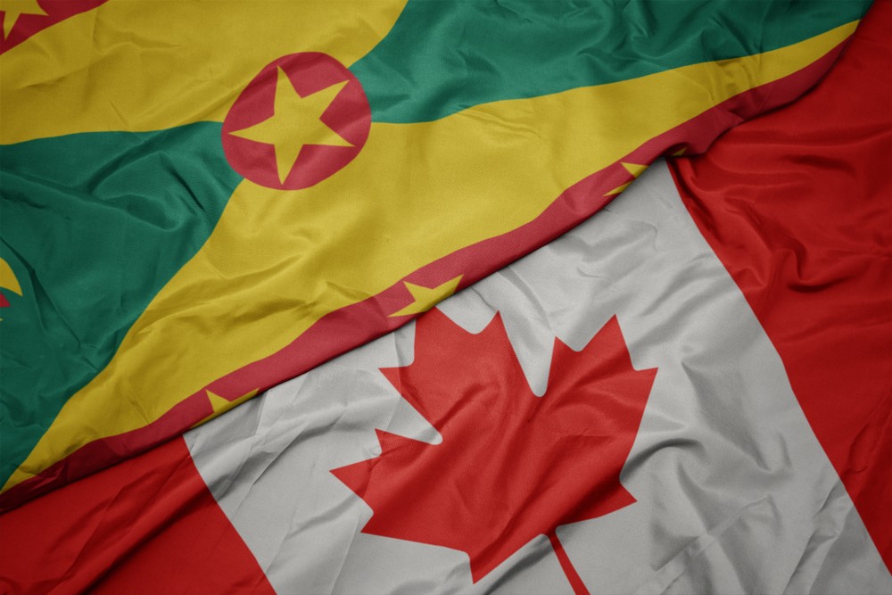 waving colorful flag of canada and national flag of grenada-img