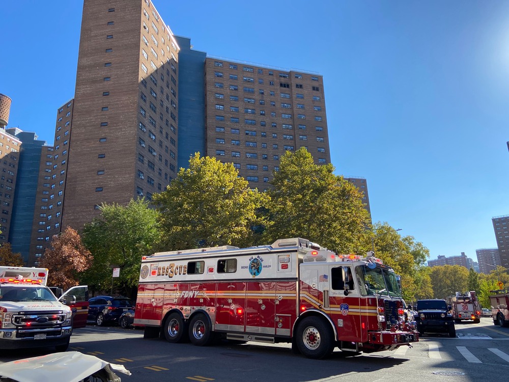 Fire trucks and an ambulance responding to an apartment fire-harlem-img