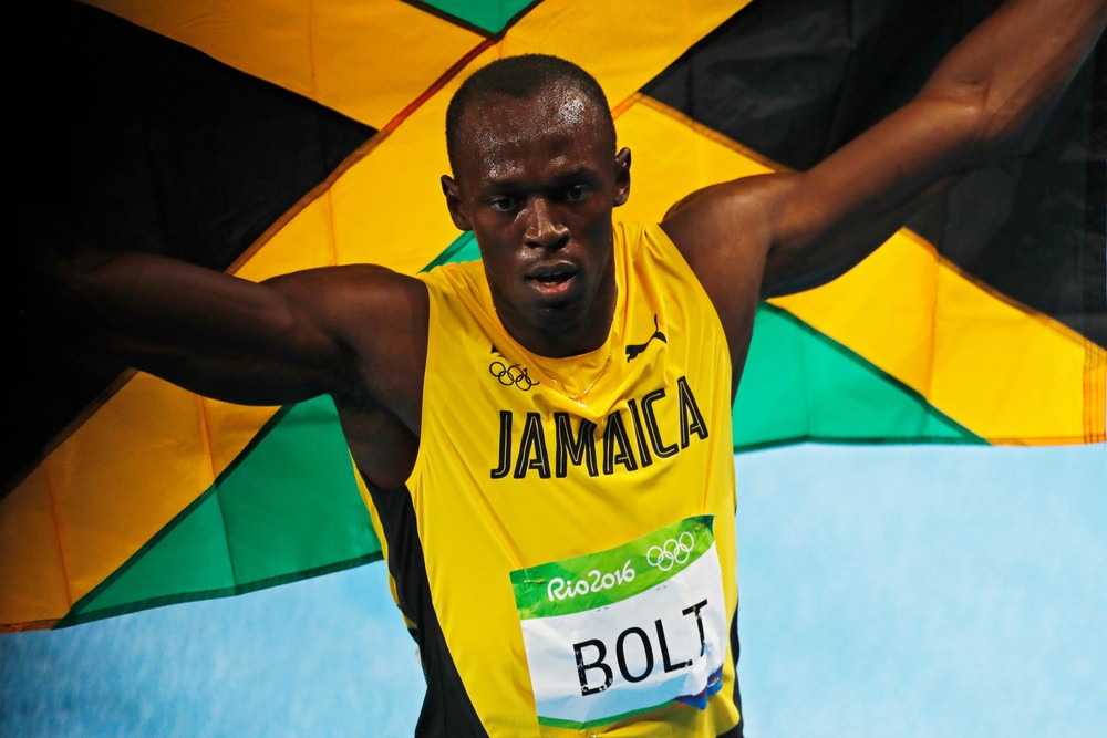 Usain Bolt of Jamaica celebrates winning gold medal 200m sprint race-img