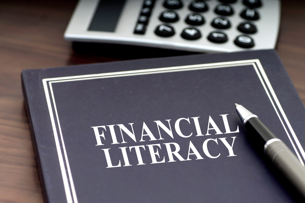 Financial,Literacy,Book,With,Pen,And,Calculator