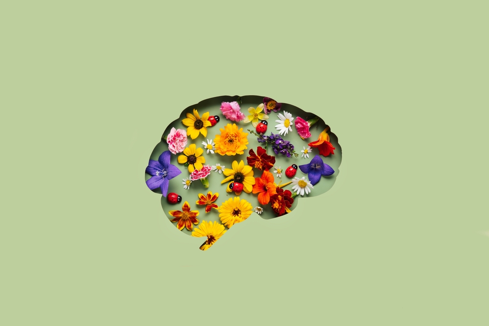 Paper,Cut,Brain,And,Flowers,On,Green,Background.,Mental,Health
