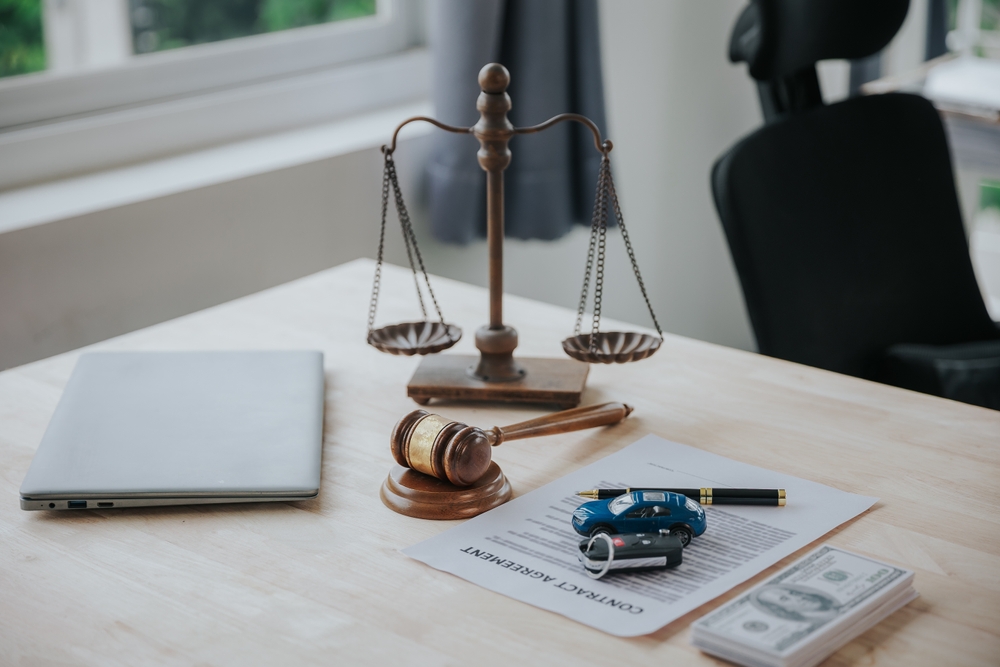 Judge,Male,Hand,With,Car,And,Documents,And,Hammer