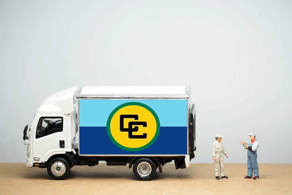 Mini,Toy,At,Table,With,White,Background.,Industrial,Shipping,Concept.