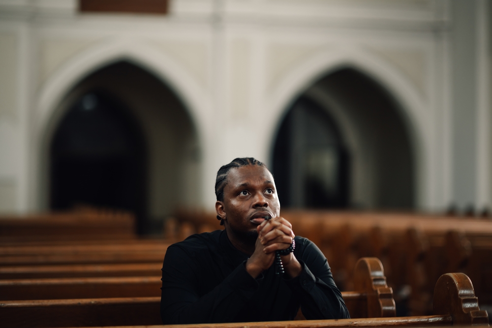 Young,Man,Finds,Peace,In,An,Empty,Church,,Praying,With Young,Man,Finds,Peace,In,An,Empty,Church,,Praying,With